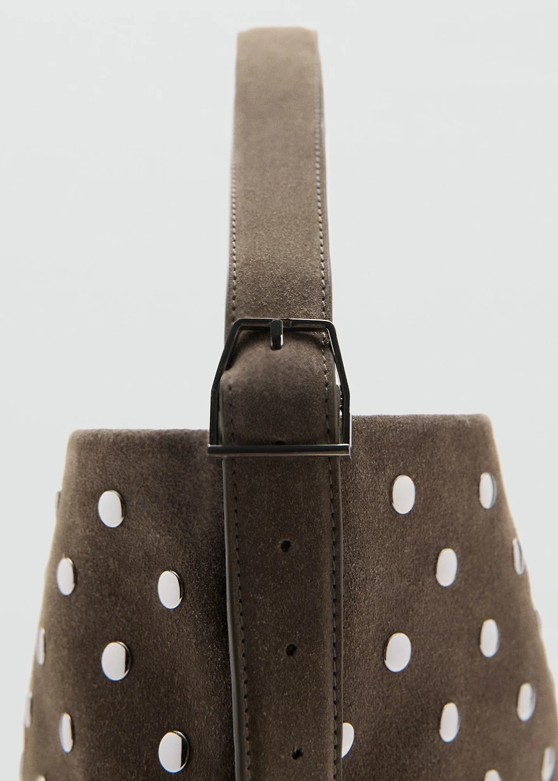 Suede bucket bag with studs