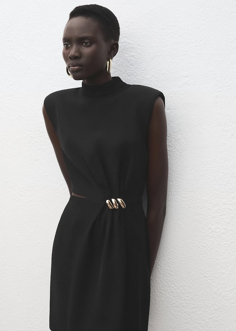 Dress with metal embellishment and cut-out