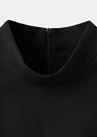 Dress with metal embellishment and cut-out