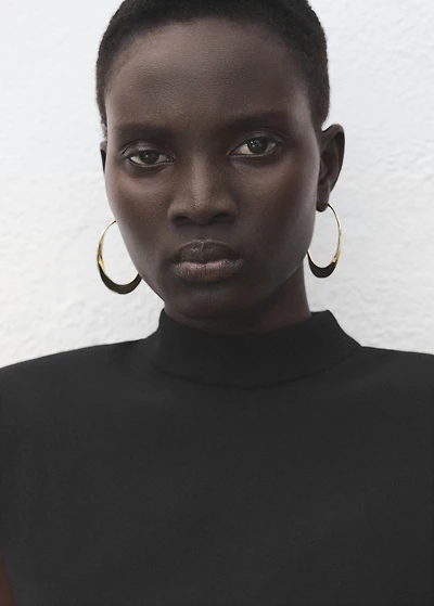 Dress with metal embellishment and cut-out