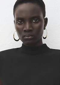 Dress with metal embellishment and cut-out