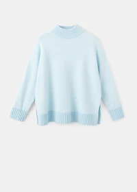 Knitted sweater with openings