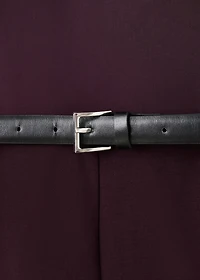 Jumpsuit with asymmetrical neckline and belt