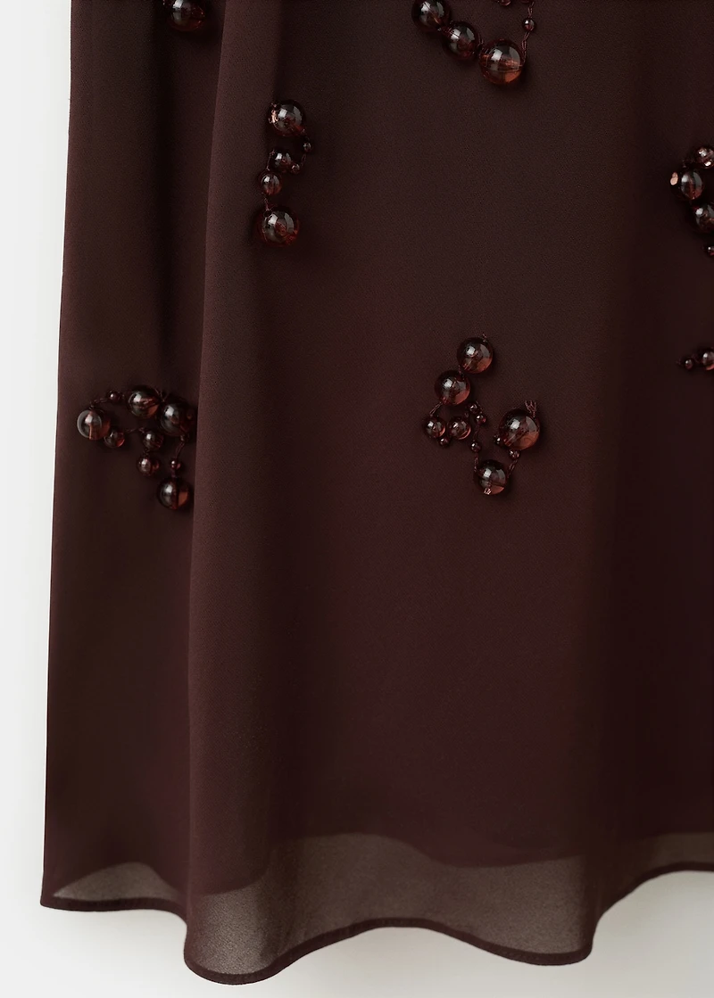 Long dress with embroidered spheres