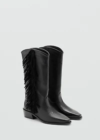 Tall leather boots with tassels