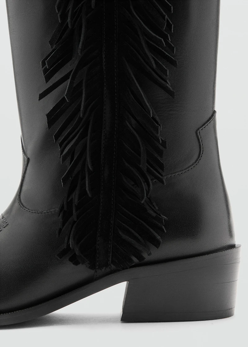 Tall leather boots with tassels