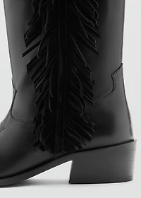 Tall leather boots with tassels