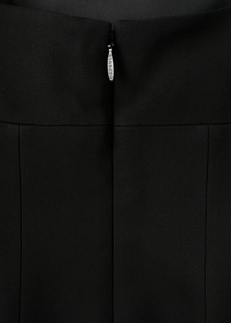 Low-cut dress with fringed hem