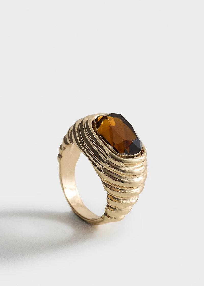 Ring with combined embossed resin