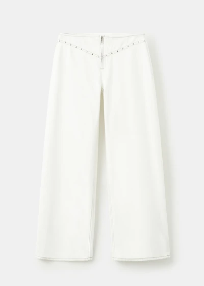 Low-waist studded jeans