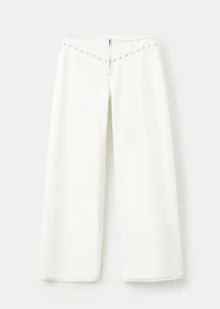 Low-waist studded jeans