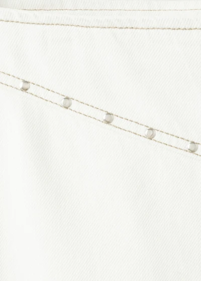 Low-waist studded jeans