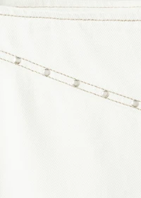 Low-waist studded jeans