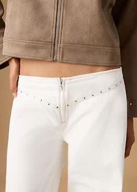 Low-waist studded jeans