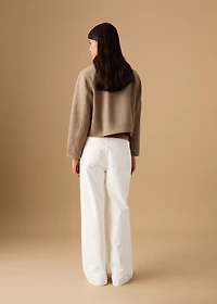 Low-waist studded jeans