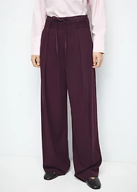 Pleated trousers with combined waistband