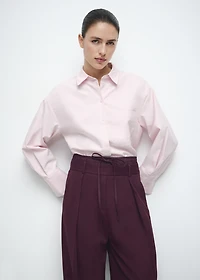 Pleated trousers with combined waistband