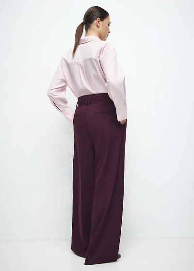 Pleated trousers with combined waistband