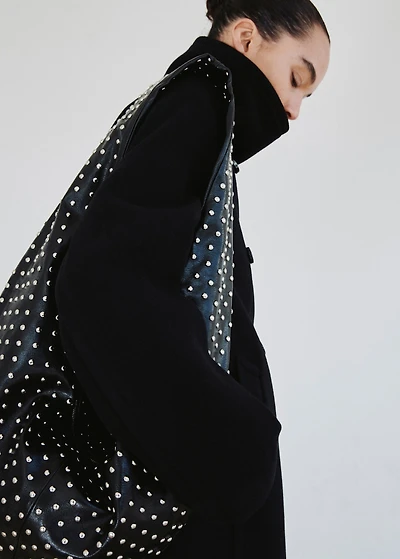 Oval studded shoulder bag