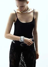 Rigid bracelet with relief