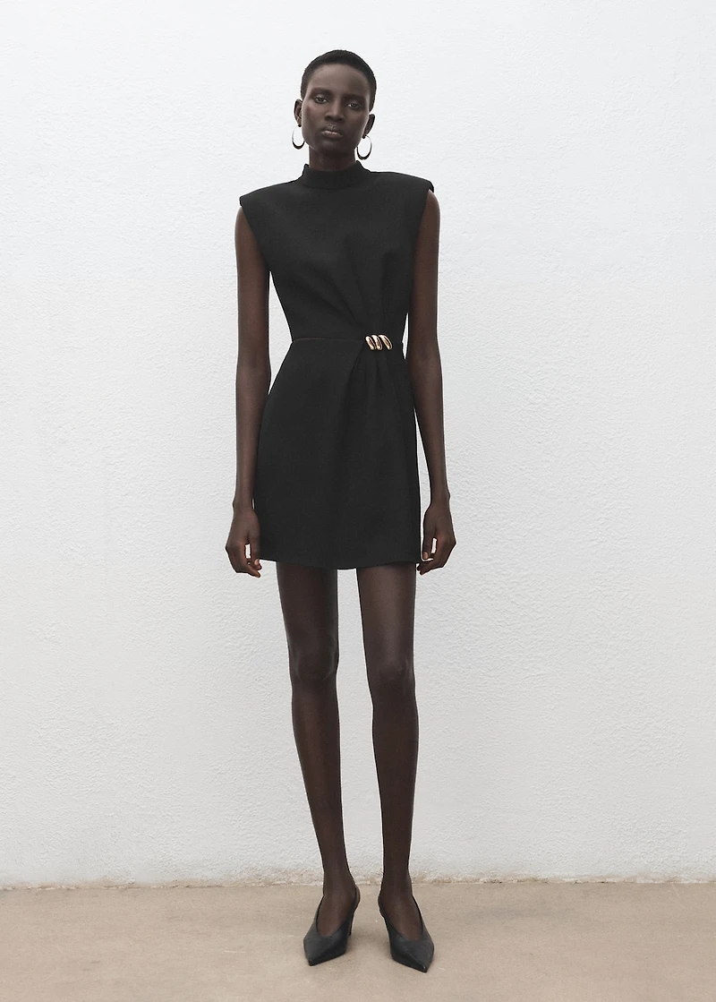 Dress with metal embellishment and cut-out