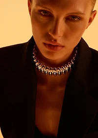 Rigid embossed choker collar