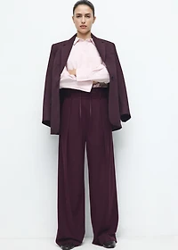 Pleated trousers with combined waistband