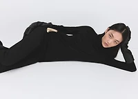 Turtleneck sweater with brooch