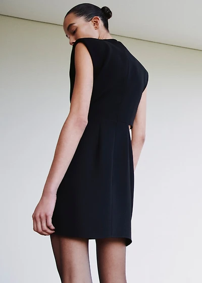 Dress with metal embellishment and cut-out