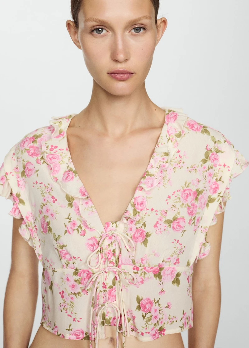 Floral blouse with bow closure