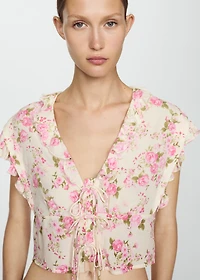 Floral blouse with bow closure