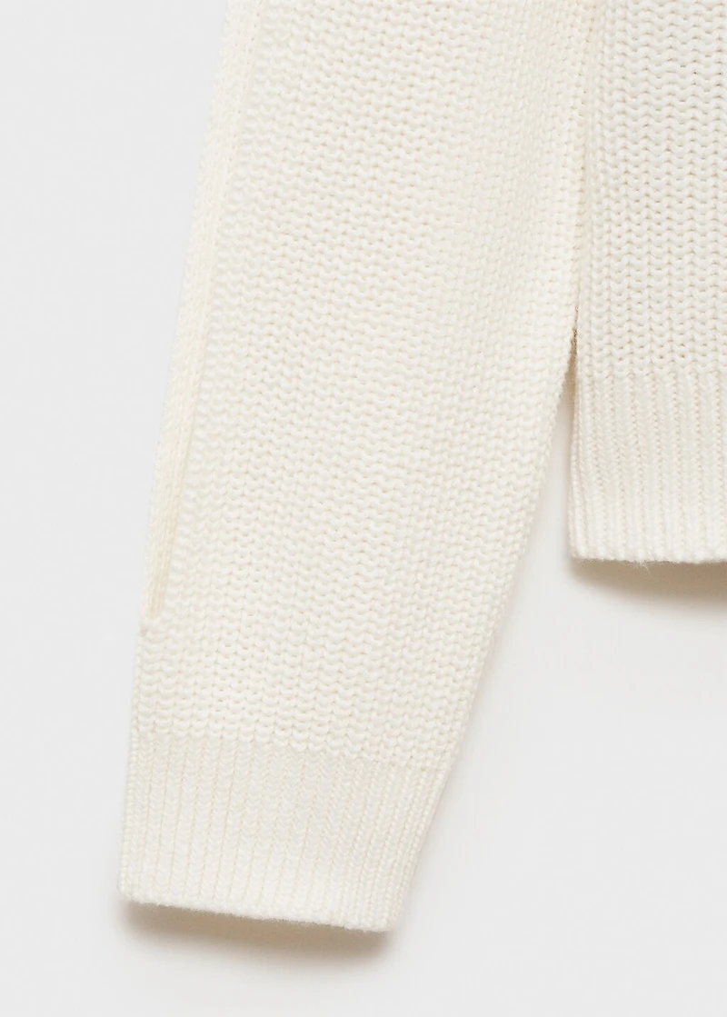 Knitted sweater with openings