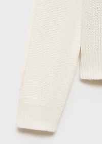 Knitted sweater with openings