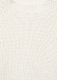 Knitted sweater with openings