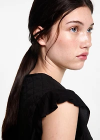 Quilted vest with pleat