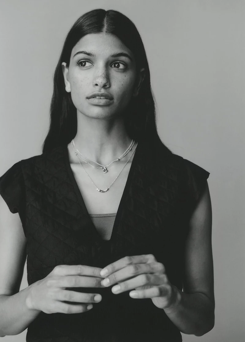 Quilted vest with pleat