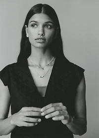 Quilted vest with pleat