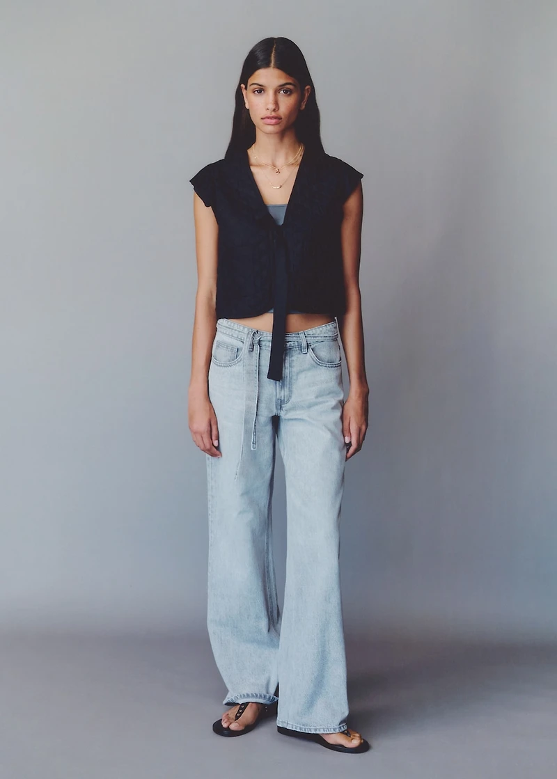 Quilted vest with pleat