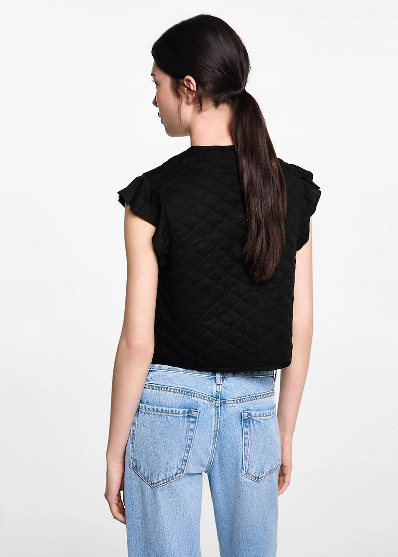 Quilted vest with pleat