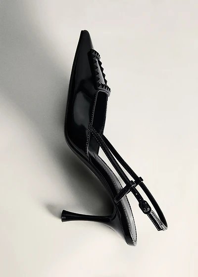 Patent leather slingback-heeled shoes