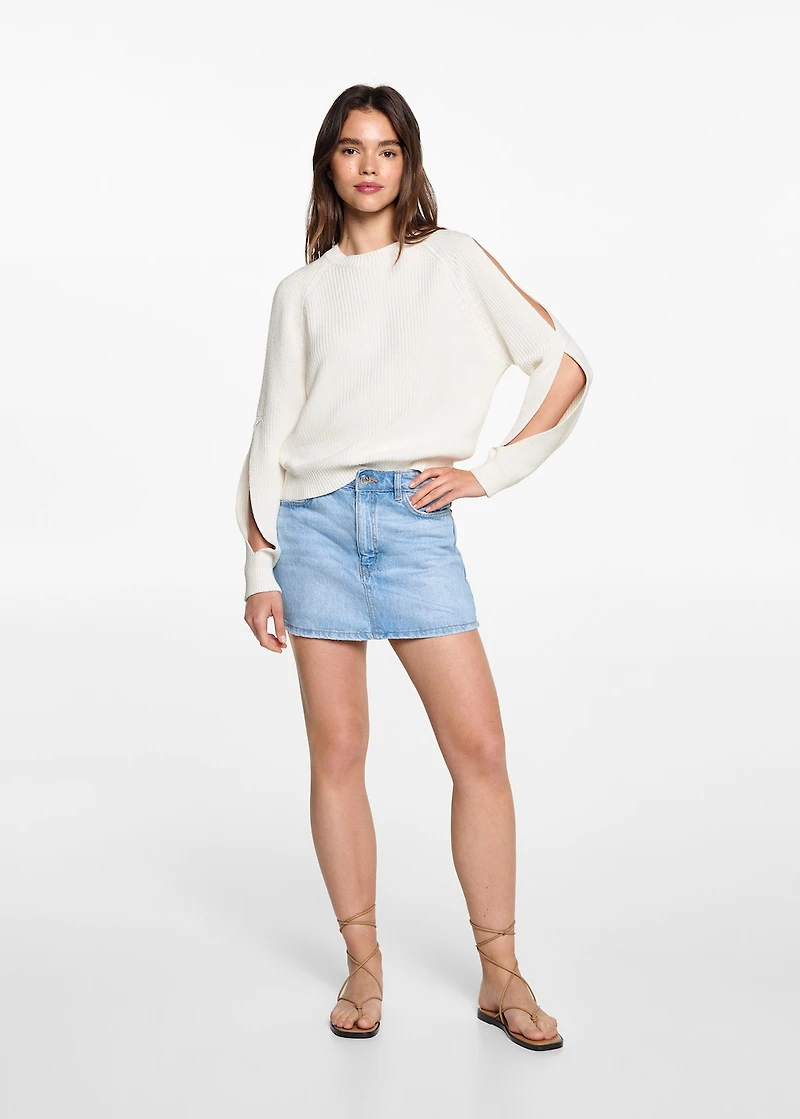 Knitted sweater with openings