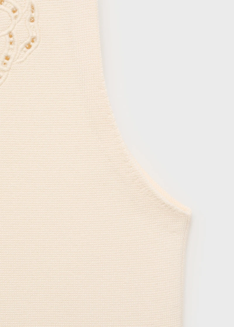 Embroidered top with lace accents