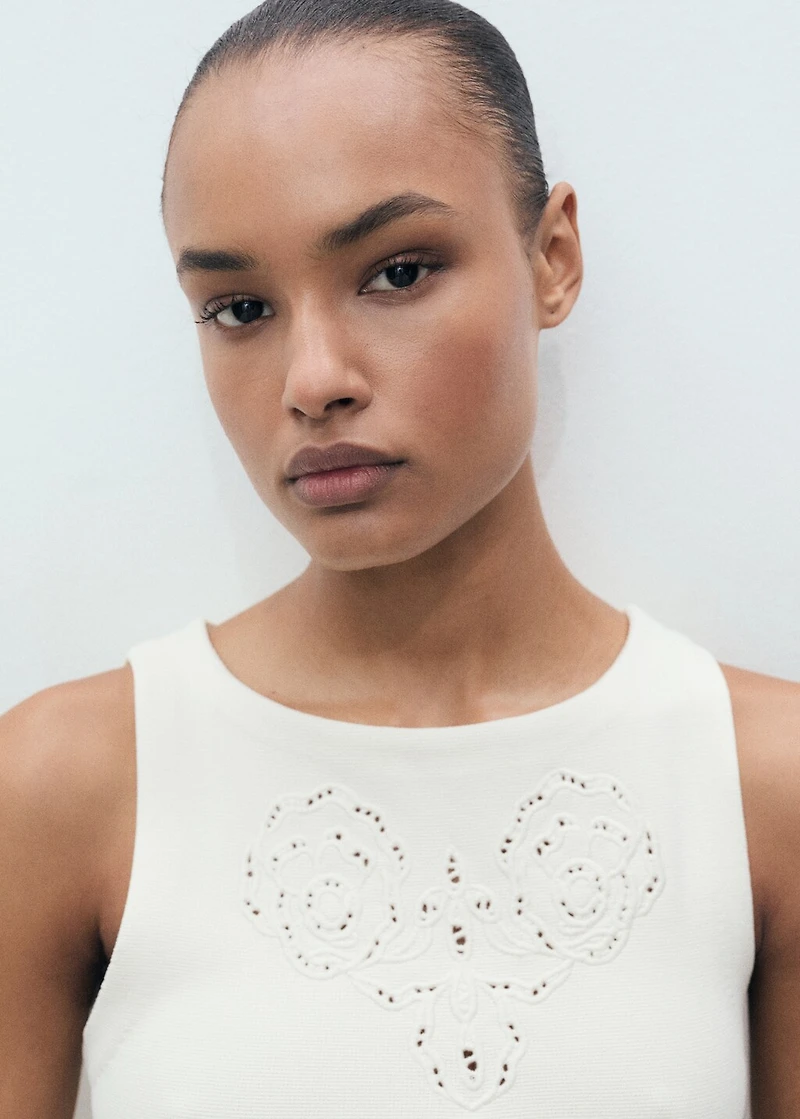 Embroidered top with lace accents