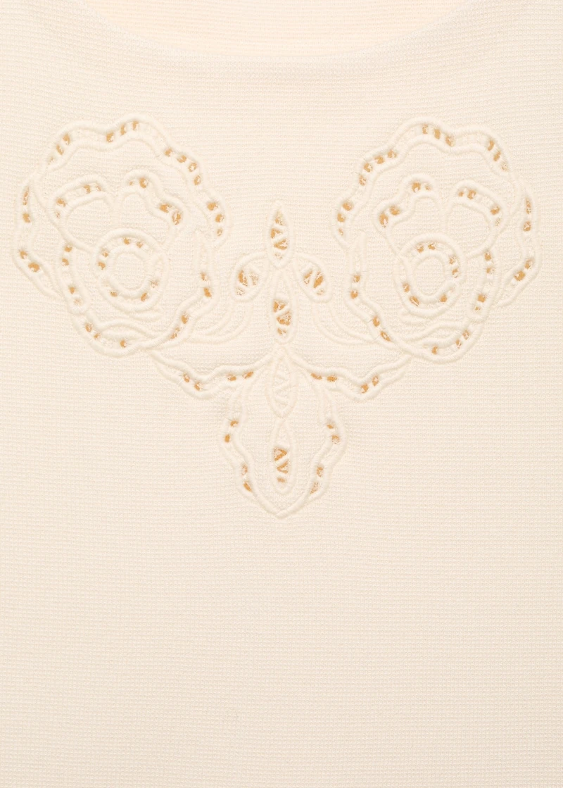 Embroidered top with lace accents