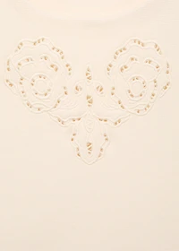 Embroidered top with lace accents