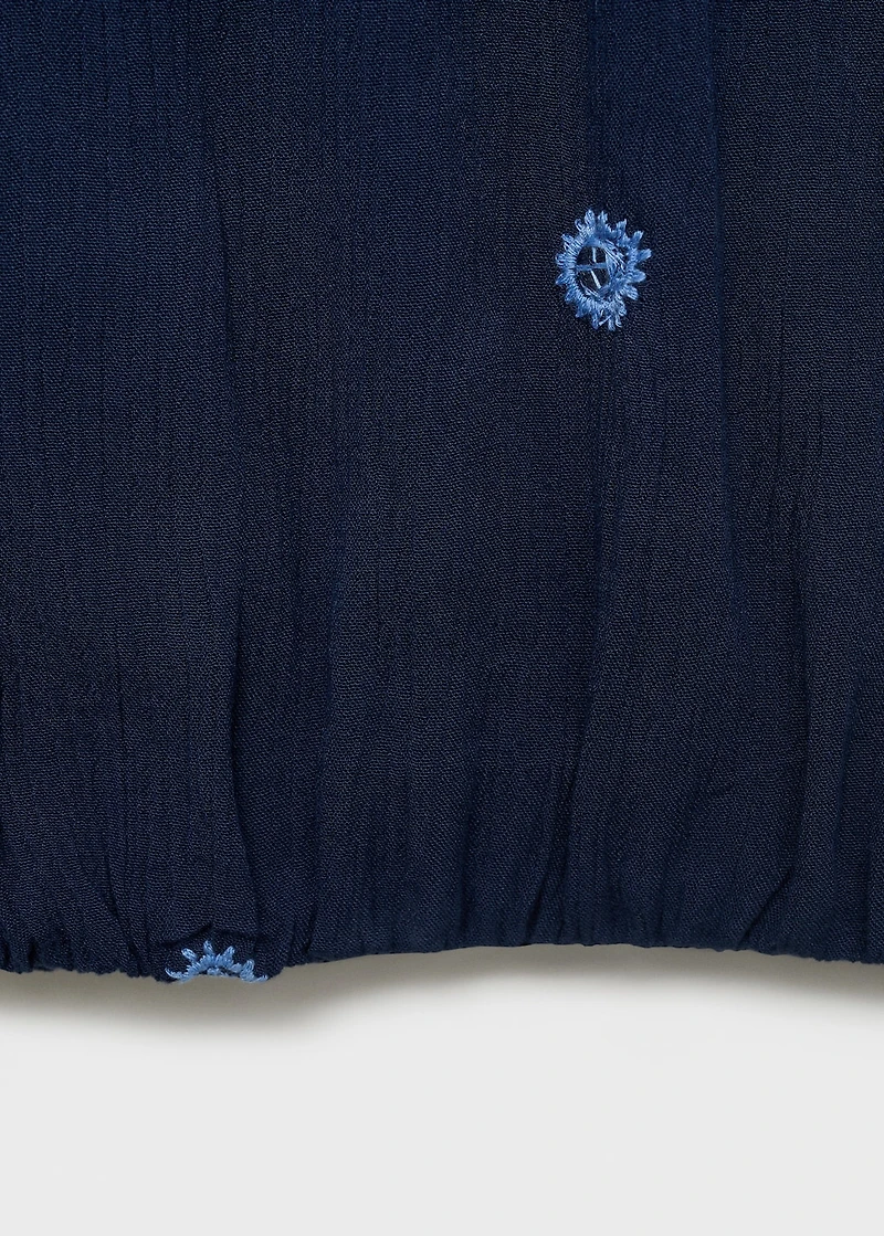 Asymmetrical top with embroidered panel