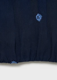 Asymmetrical top with embroidered panel