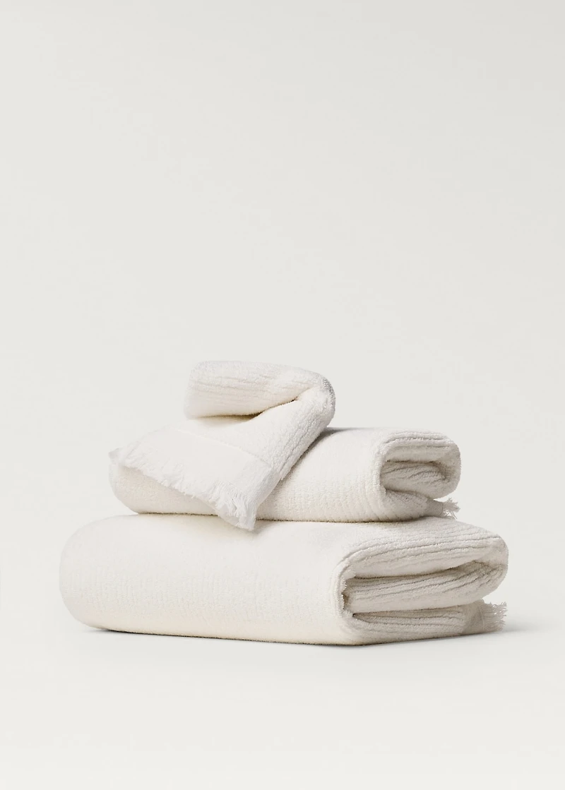 Stripe-embossed hand towel with fringes