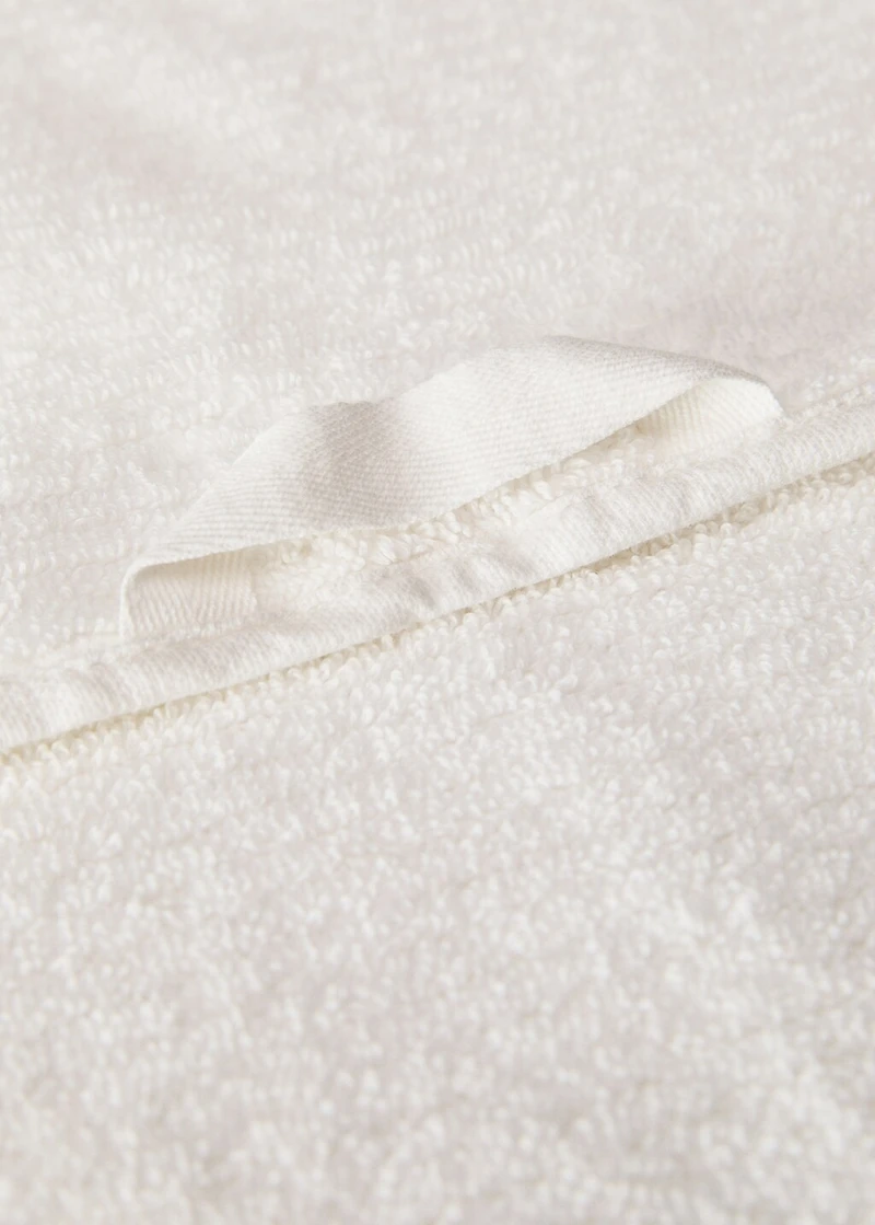 Stripe-embossed hand towel with fringes