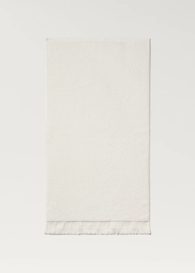 Stripe-embossed hand towel with fringes